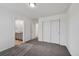 Bedroom with neutral carpet, walk-in closet, and an ensuite bathroom at 12826 Lake Port St, Longmont, CO 80504