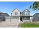 Charming two-story home features a three car garage, well-manicured lawn and a covered front porch at 12826 Lake Port St, Longmont, CO 80504