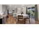 Eat in kitchen area featuring a sliding glass doors, dining table, and views of the backyard at 12826 Lake Port St, Longmont, CO 80504