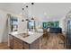 Open-concept kitchen with granite counters, stainless steel appliances and an eat-in dining area at 12826 Lake Port St, Longmont, CO 80504