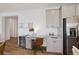 Eat in kitchen with built in desk area, stainless steel refrigerator and plenty of storage at 12826 Lake Port St, Longmont, CO 80504
