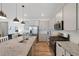 Modern kitchen with an island, stainless steel appliances, and plenty of counter space at 12826 Lake Port St, Longmont, CO 80504
