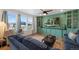Cozy living room featuring custom built-ins, modern furniture, and a large window at 12826 Lake Port St, Longmont, CO 80504