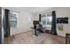 Sunlit home office with a large rug and windows overlooking the neighborhood at 12826 Lake Port St, Longmont, CO 80504