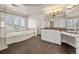 Bright bathroom featuring a separate shower, soaking tub, dual sinks, and a vanity at 4505 W 100Th Ave, Westminster, CO 80031