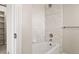Bathroom features a white bath tub with tiled surround, white walls and ceiling, and chrome fixtures at 4505 W 100Th Ave, Westminster, CO 80031