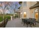 Outdoor deck with wrought iron furniture overlooking lush green golf course at dusk at 4505 W 100Th Ave, Westminster, CO 80031