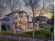 Back of home with multiple balconies, large yard, and stairs to lower patio at 4505 W 100Th Ave, Westminster, CO 80031