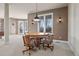 Basement area features a hardwood table with four rolling chairs, and custom sconce lighting at 4505 W 100Th Ave, Westminster, CO 80031