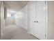 Hallway with carpet, ample storage space and a door leading to other parts of the home at 4505 W 100Th Ave, Westminster, CO 80031