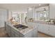 Open concept kitchen with granite countertops, a center island, and stainless steel appliances at 4505 W 100Th Ave, Westminster, CO 80031