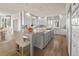 Spacious kitchen with a large center island, granite countertops, and modern appliances at 4505 W 100Th Ave, Westminster, CO 80031