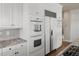 Gourmet kitchen with built-in oven, refrigerator, and granite countertops at 4505 W 100Th Ave, Westminster, CO 80031