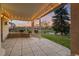 Covered patio with string lights overlooking a scenic view of the golf course and pond at 4505 W 100Th Ave, Westminster, CO 80031
