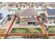 Aerial view of a fenced backyard featuring a patio, barbecue, and green lawn at 25064 E Archer Pl, Aurora, CO 80018