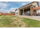 Large backyard featuring a patio, hot tub, and well-maintained lawn at 25064 E Archer Pl, Aurora, CO 80018