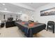 Finished basement with a stylish poker table and comfortable seating area at 25064 E Archer Pl, Aurora, CO 80018