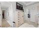 Bedroom with a faux fur rug, open doorway and large dresser with TV at 25064 E Archer Pl, Aurora, CO 80018
