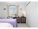 Cozy bedroom featuring a nightstand, natural light and decorations at 25064 E Archer Pl, Aurora, CO 80018