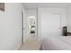 Comfortable bedroom featuring a full bed and a closet with natural light and fresh white paint at 25064 E Archer Pl, Aurora, CO 80018