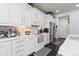 Bright kitchen features white cabinets, stone countertops and stainless steel appliances at 25064 E Archer Pl, Aurora, CO 80018