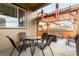 Outdoor patio with a pergola, a table with chairs, and a fire pit at 25064 E Archer Pl, Aurora, CO 80018