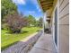 Exterior view of the backyard, featuring a patio, and lush green grass at 6827 S Webster St # E, Littleton, CO 80128
