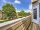 Balcony view with lush greenery and mature trees overlooking the green community landscape at 6827 S Webster St # E, Littleton, CO 80128
