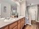 Bathroom featuring double sinks, a large mirror, and modern vanity at 6827 S Webster St # E, Littleton, CO 80128