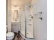 Bathroom featuring wood laminate floor and walk-in shower at 6827 S Webster St # E, Littleton, CO 80128