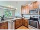 Updated kitchen featuring granite countertops, stainless steel appliances and hardwood floors at 6827 S Webster St # E, Littleton, CO 80128