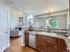 Modern kitchen featuring granite counters, stainless steel appliances and open view to the living room at 6827 S Webster St # E, Littleton, CO 80128