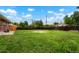 Expansive backyard showcasing a lush lawn, privacy fence, and ample space for outdoor activities at 6698 S Wellington Ct, Centennial, CO 80121