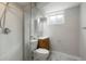 Finished bathroom featuring toilet, sink, shower, and tile flooring at 6698 S Wellington Ct, Centennial, CO 80121