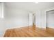 Spacious bedroom with hardwood floors, light paint, and baseboard trim at 6698 S Wellington Ct, Centennial, CO 80121
