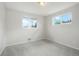 Bedroom with gray carpet, white walls, and double hung windows at 6698 S Wellington Ct, Centennial, CO 80121