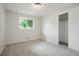 Cozy bedroom featuring closet and view to outside at 6698 S Wellington Ct, Centennial, CO 80121