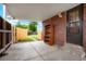 Outdoor patio area with brick accents, providing a sheltered space for relaxation and storage at 6698 S Wellington Ct, Centennial, CO 80121