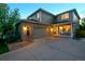 Charming two-story home with a covered porch, attached garage, and well-manicured lawn at 16829 Trail View Cir, Parker, CO 80134
