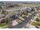 Aerial view showcasing a neighborhood with beautiful homes, lush green lawns, and tree-lined streets, perfect for families at 6994 S Fultondale Cir, Aurora, CO 80016