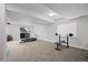 Finished basement with workout area, carpet flooring, and bright lighting offers versatile space at 6994 S Fultondale Cir, Aurora, CO 80016