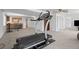 Spacious finished basement featuring a treadmill and open layout at 6994 S Fultondale Cir, Aurora, CO 80016