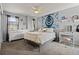 Cozy bedroom with modern decor, including a statement wall hanging, and bright natural light at 6994 S Fultondale Cir, Aurora, CO 80016