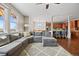 Open-concept living space showcasing hardwood floors, modern decor, and seamless flow to the kitchen at 6994 S Fultondale Cir, Aurora, CO 80016