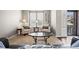 Comfortable living room featuring two chairs and light filled windows at 6994 S Fultondale Cir, Aurora, CO 80016
