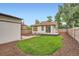 Backyard featuring green grass, wood deck and exterior view of home at 3975 Yates St, Denver, CO 80212