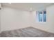 Basement bedroom with soft carpeting, recessed lighting, and a window for natural light at 3975 Yates St, Denver, CO 80212