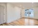 Bright bedroom with light wood floors, recessed lighting, and a window overlooking the backyard at 3975 Yates St, Denver, CO 80212