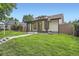 Charming home featuring a covered porch, landscaped yard, and modern architectural details at 3975 Yates St, Denver, CO 80212