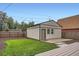 Detached garage with a compact design and a well-kept exterior that matches the home at 3975 Yates St, Denver, CO 80212